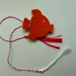 Martisor peste portocaliu din fetru / pasla